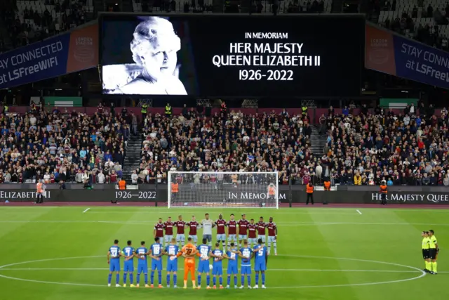 Players pause during a minutes silence before tonight's Europa League match between West Ham United v FCSB in London