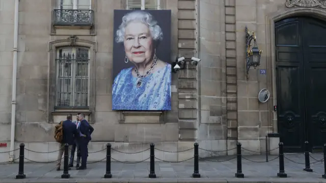 A portrait of the Queen hanging outside the British embassy in Paris, France