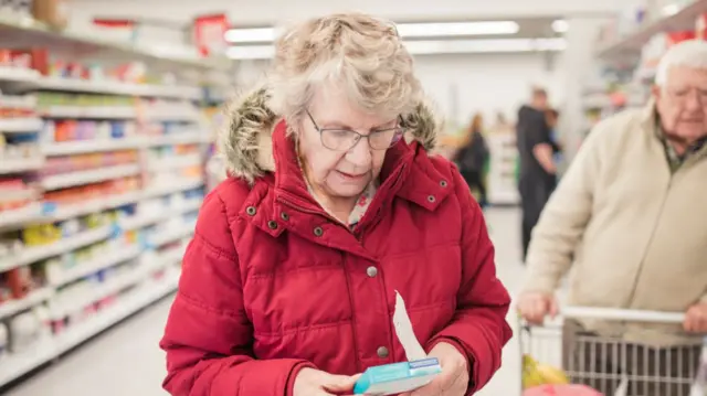 People shopping in supermarket