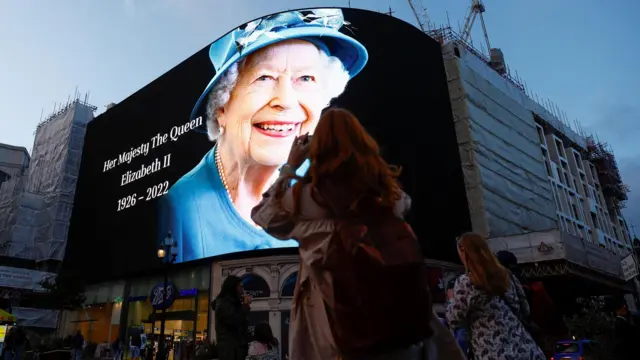 An image paying tribute to Queen Elizabeth II displayed at Piccadilly Circus in London