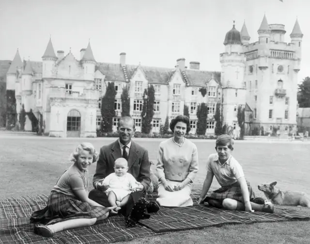 Queen Elizabeth II and Prince Philip, Duke of Edinburgh with their children, Prince Andrew (centre), Princess Anne (left) and Charles, Prince of Wales