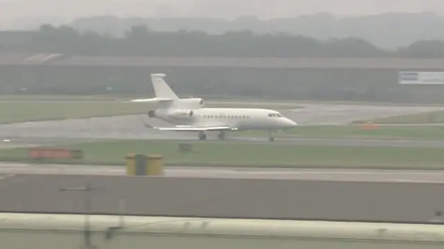 A plane carrying members of the Royal Family lands at Aberdeen Airport