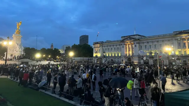 Hundreds of people gathered outside Buckingham Palace tonight