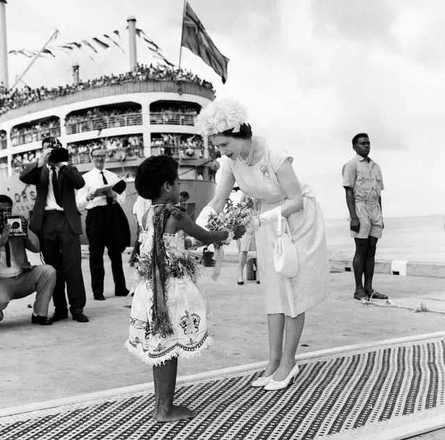 The Queen pictured with a young girl during a royal visit to Fiji in 1963.