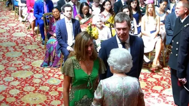 Gavin Frost and his sister Nicola Pritchard receiving the MBE from the Queen
