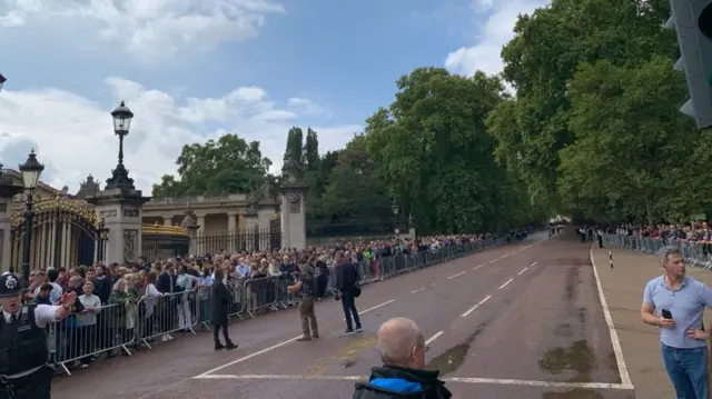People queuing outside Buckingham Palace
