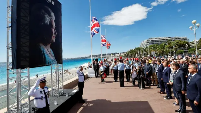 Flags flying at half mast at a remembrance ceremony for the Queen in Nice, France