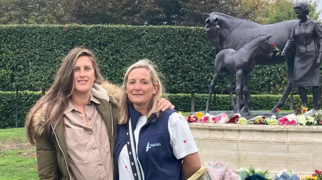 Jane (left) and Suzanne alongside a statue of the Queen in the town of Newmarket