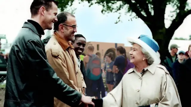 Mark meeting the Queen and shaking her hand