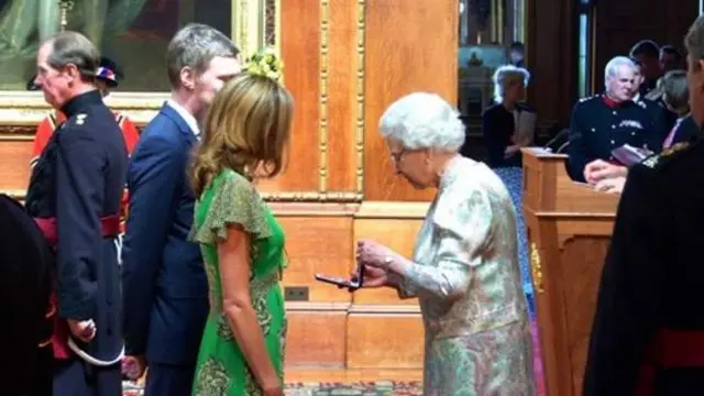 Gavin Frost and his sister, Nicola Pritchard, receiving their mum's MBE from the Queen
