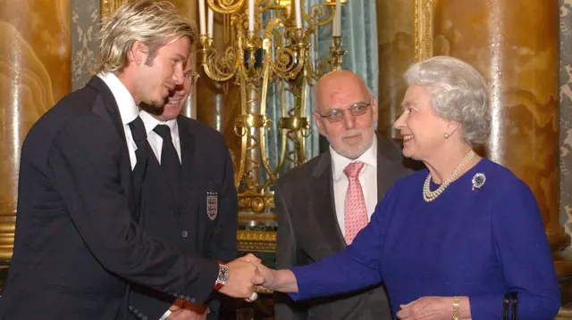 David Beckham shakes hands with the Queen