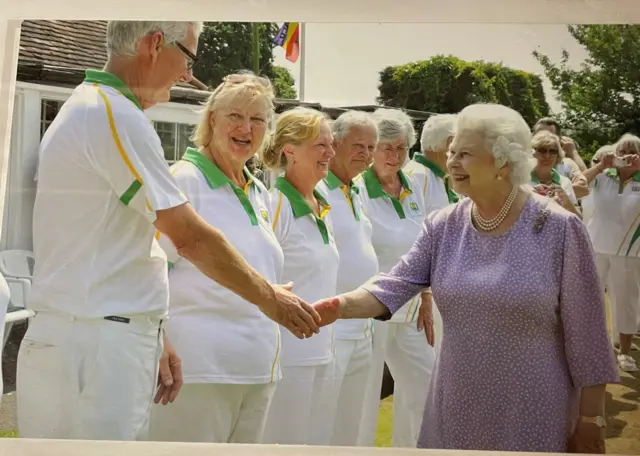 The Queen meeting people at Brimfield and Little Hereford Bowls Club