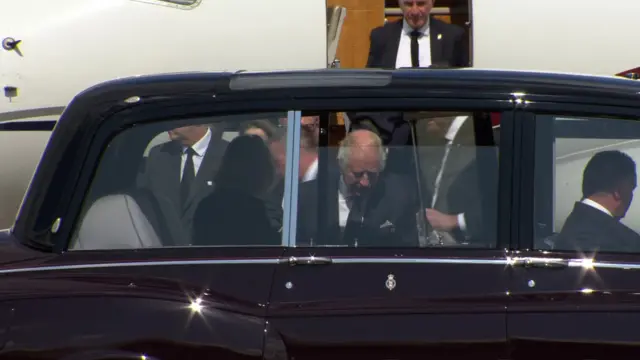 King Charles getting into a car