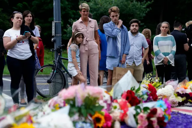 Well-wishers leave flowers at the British Embassy following the death of Queen Elizabeth II in Washington, DC