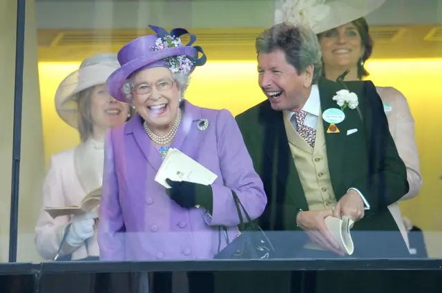 Queen Elizabeth II with her racing manager John Warren after her horse, Estimate, won the Gold Cup at Royal Ascot in 2013