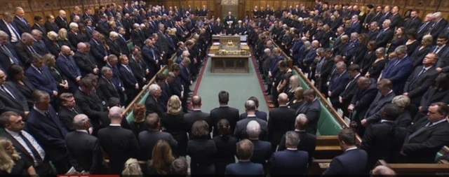 MPs bow their heads during a moment of silence to remember the Queen