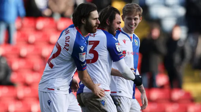 Bradley Dack celebrates with his team-mates