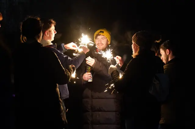 Revellers on Carlton Hill light sparklers