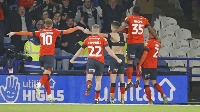Reece Burke celebrates his goal for Luton at Huddersfield