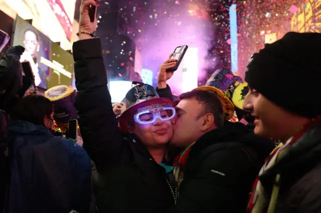 People kiss at midnight