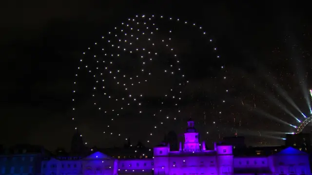 Light display of Queen's portrait on a coin