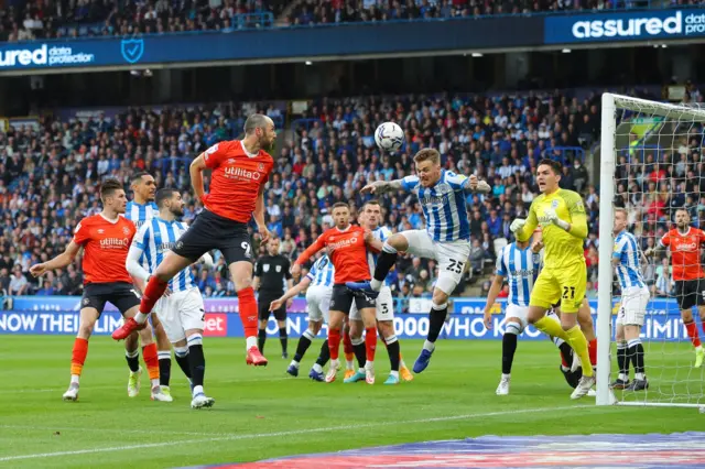 Luton and Huddersfield players compete for a corner in their play-off semi-final second leg last season
