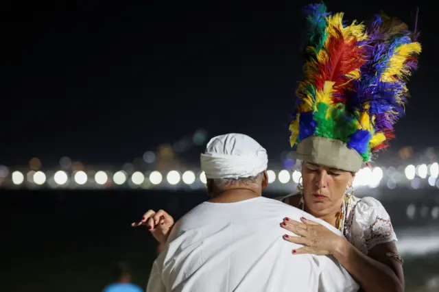 People make offerings to the Afro-Brazilian goddess of the sea, Lemanja, in Rio de Janeiro