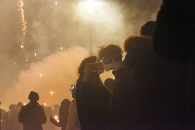 A couple kiss
