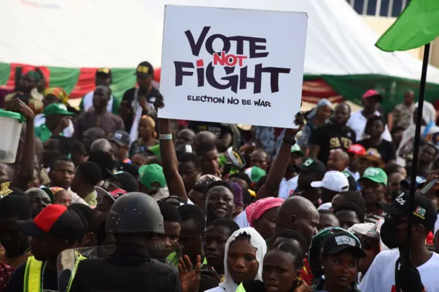 A Labour Party (LP)'s supporter holds a placard during a campaign rally at Adamasingba Stadium in Ibadan, southwestern Nigeria, on November 23, 2022, ahead of the 2023 Nigerian presidential election.