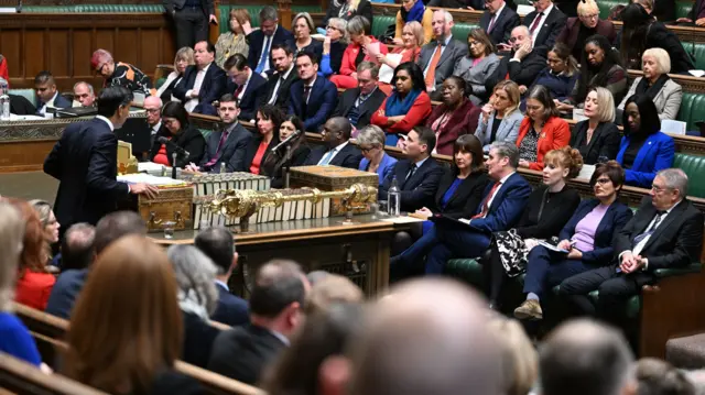 PM Rishi Sunak responds to Labour leader Sir Keir Starmer during PMQs on 14 December 2022