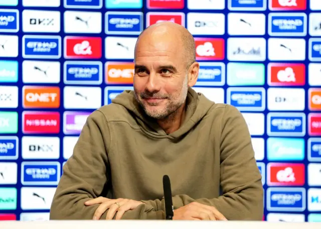 Pep Guardiola speaking at a news conference