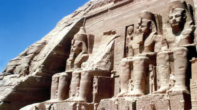 The four colossal statues of the Egyptian king Ramses II (aka Rameses, Ramesses), at the entrance to the Great Temple in Abu Simbel, near Aswan, Egypt. October 1979.