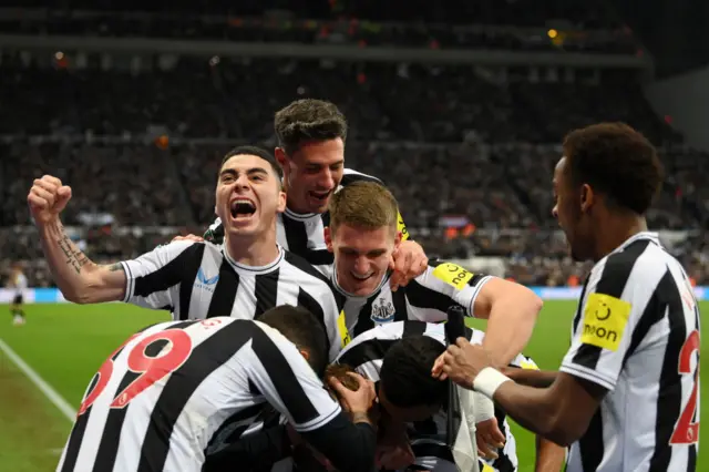 Miguel Almiron of Newcastle United celebrates with team mates