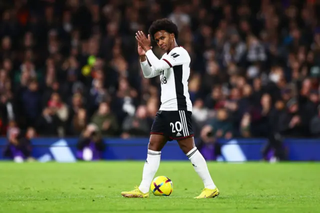 Willian claps the fans as he is subbed by Fulham.