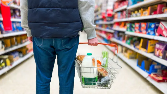 A man shops in a grocery store