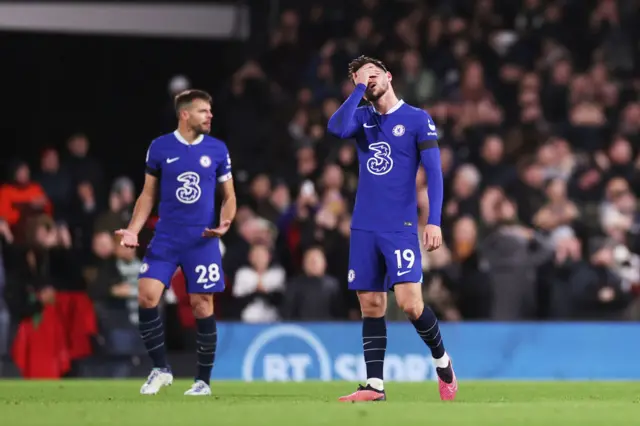 Mason Mount looks frustrated with his hand covering his face.