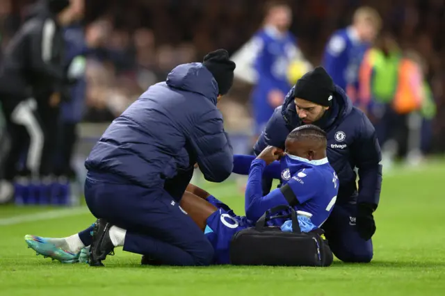 Denis Zakaria is attended to by physios