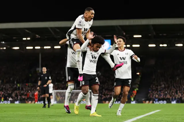 Fulham celebrate Willian's opening goal.
