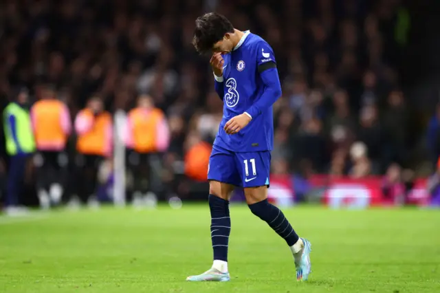 Joao Felix walks off for Chelsea after being sent off.