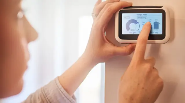 Smart meter being set on a wall