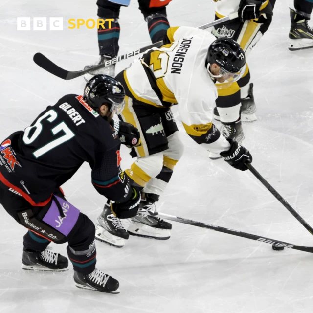 David Gilbert and Nottingham Panthers Tanner Sorenson battle for the puck