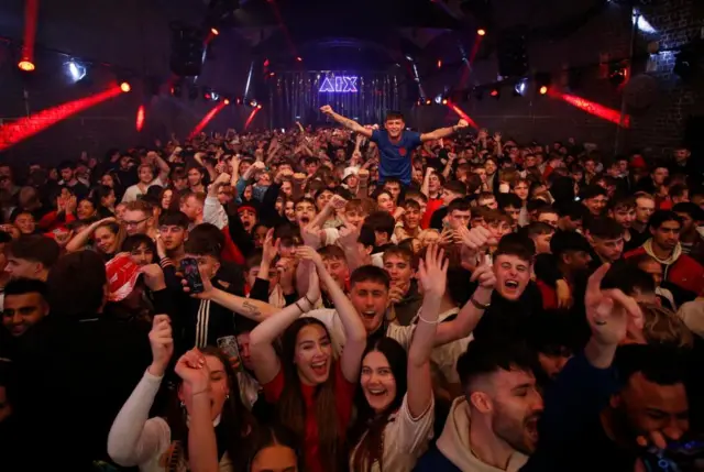 Fans in Manchester watch Wales v England in the World Cup