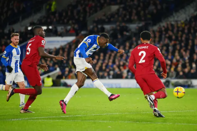 Danny Welbeck scores Brighton's third goal against Liverpool.