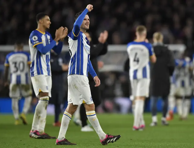 Brighton players celebrate their huge win over Liverpool.