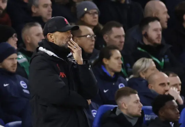 Liverpool boss Jurgen Klopp watches on.