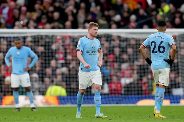 Man City players look bewildered after losing the lead at Old Trafford.