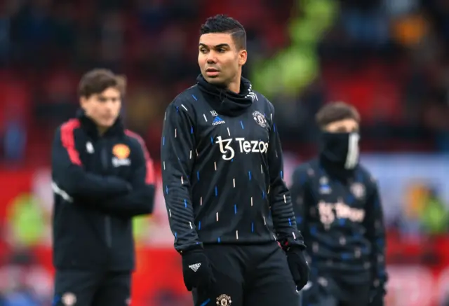 Man United midfielder Casemiro warms up ahead of the Manchester Derby.