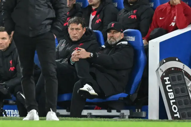 Jurgen Klopp sits frustrated on the Liverpool bench.