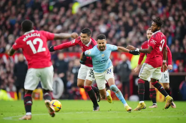 Man City's Riyad Mahrez appeals for a foul at the edge of the penalty area.