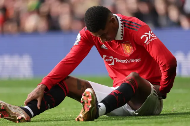 Man Utd forward Marcus Rashford goes down injured.